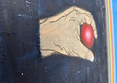 Die linke Hand mit Ball von links aufgenommen